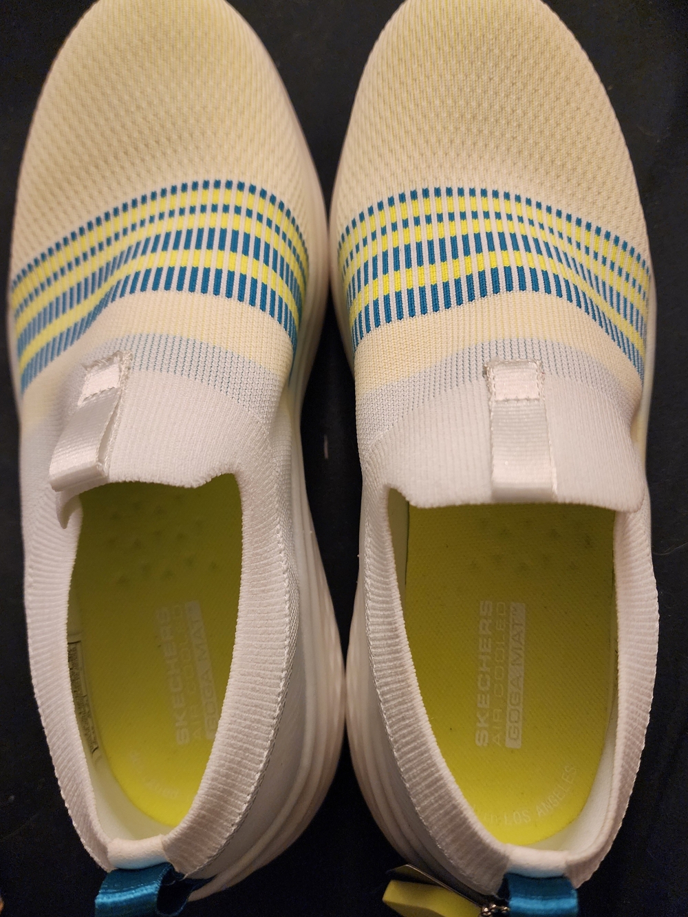 Skechers Women's White Slip-On Sneakers with Blue & Yellow Accents